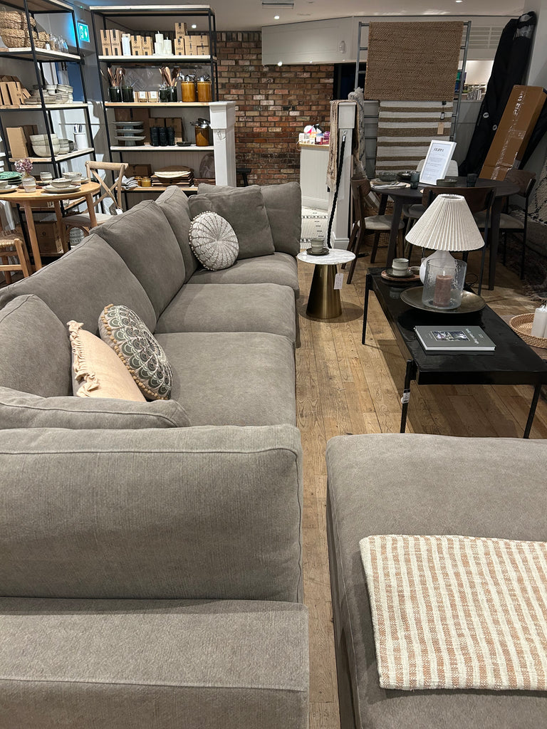 Grey sectional sofa in a living room setting